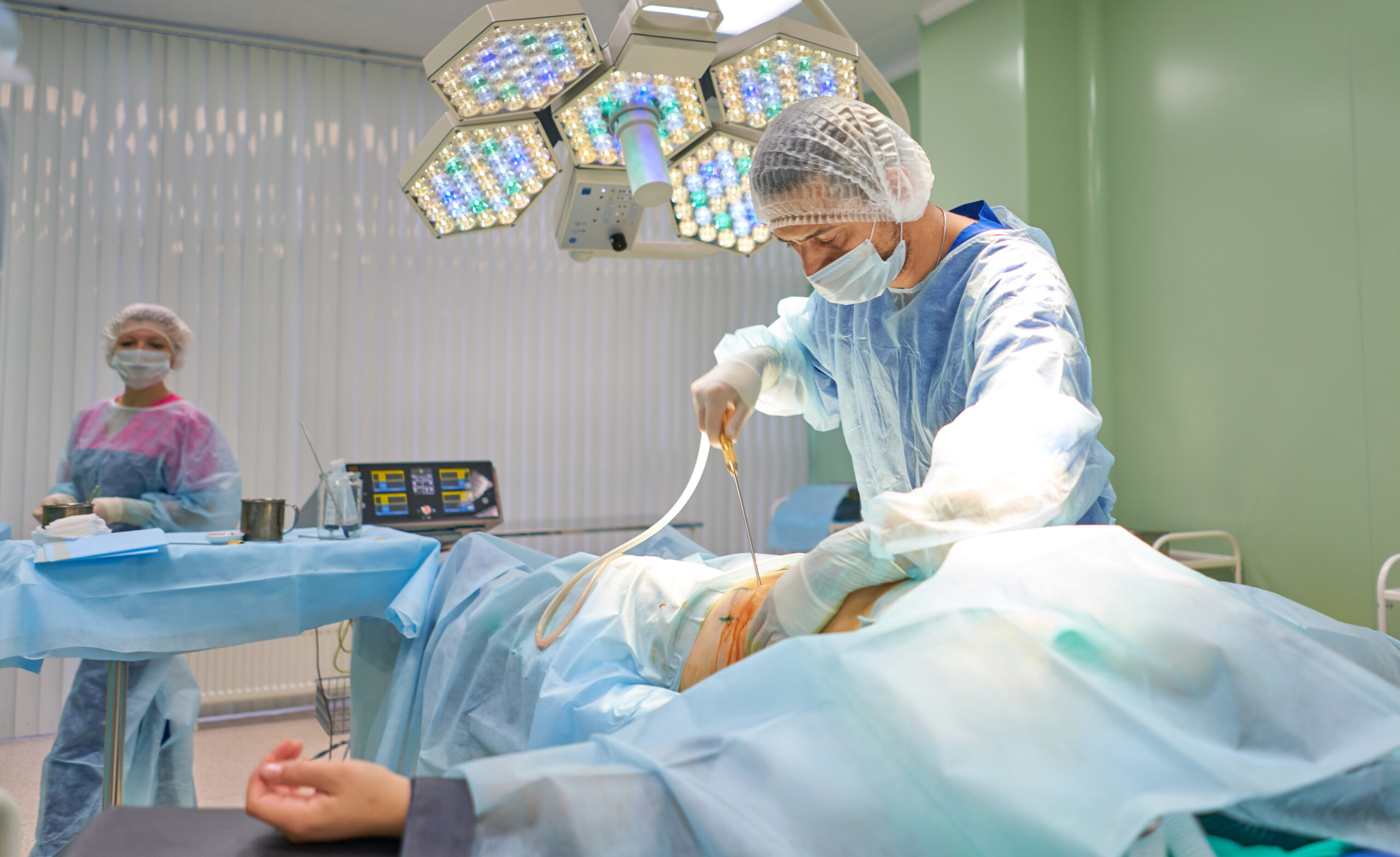 surgeon during liposuction